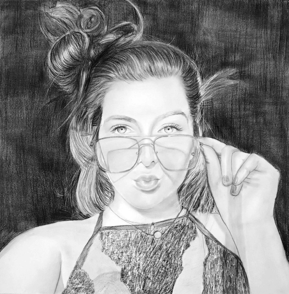 A charcoal portrait of a woman with glasses, perfect for a Bridal Shower.