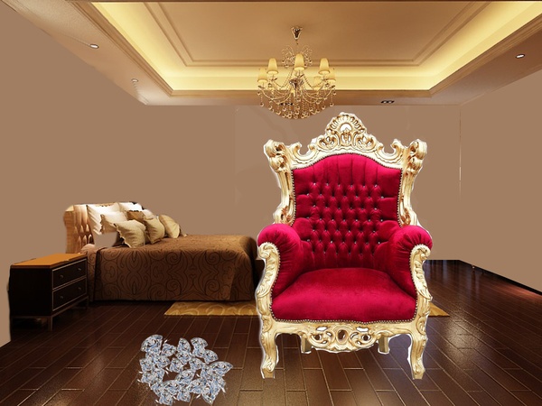 A red and gold throne chair in a bedroom.