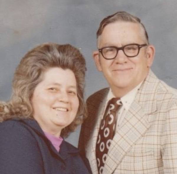 A man and woman posing for a photo.