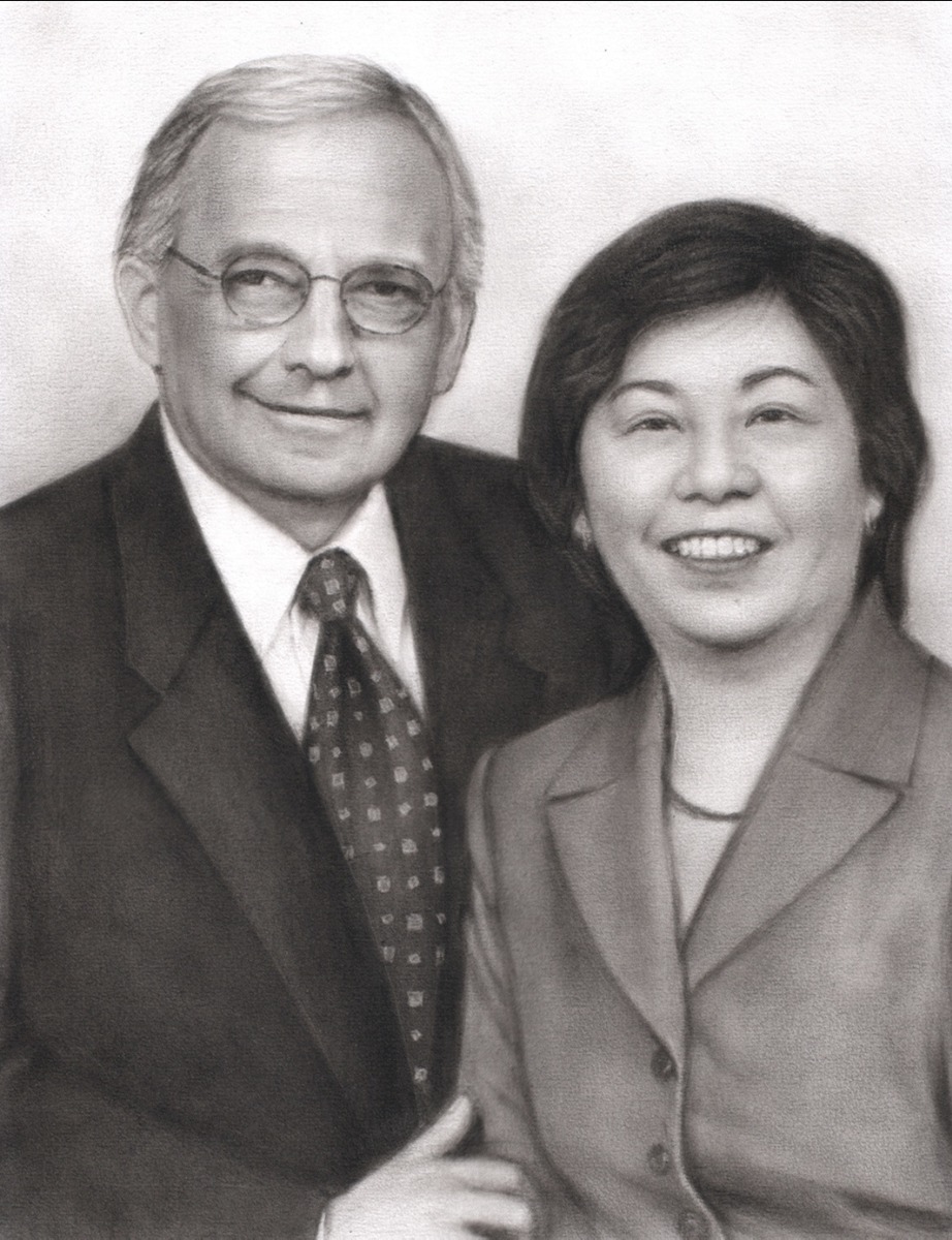 A premium charcoal family portrait drawing of an older man and woman.