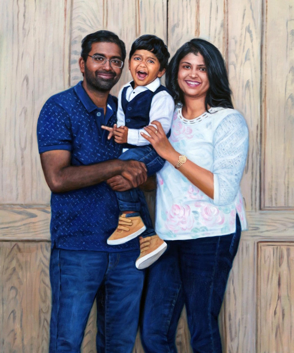 A family poses for a portrait in front of a wooden door to create a special painting for their anniversary.