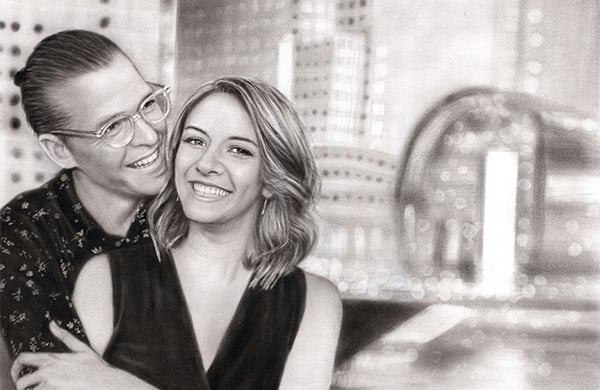 premium charcoal sketch of a couple smiling with a faded city building background