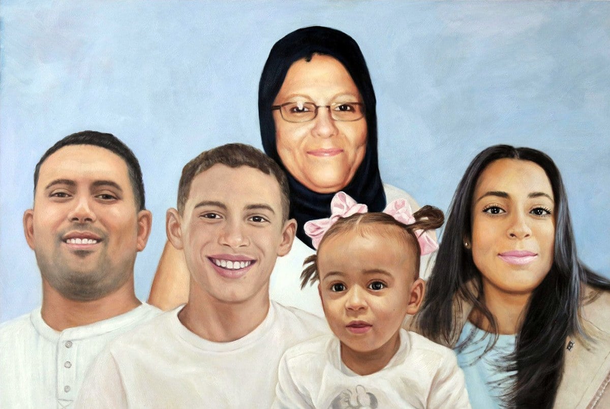 A fine oil painting of a family posing for a graduation portrait.