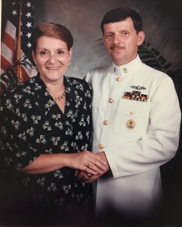A man and woman in uniform posing for a photo.