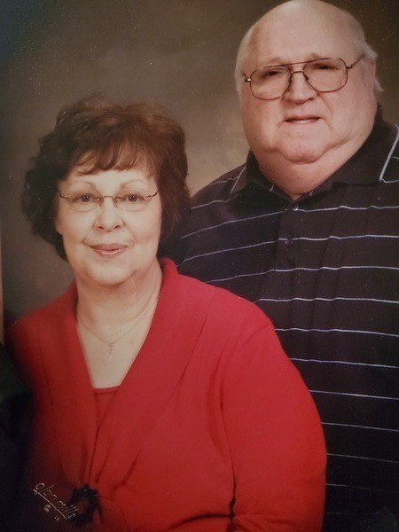 An older couple posing for a photo.