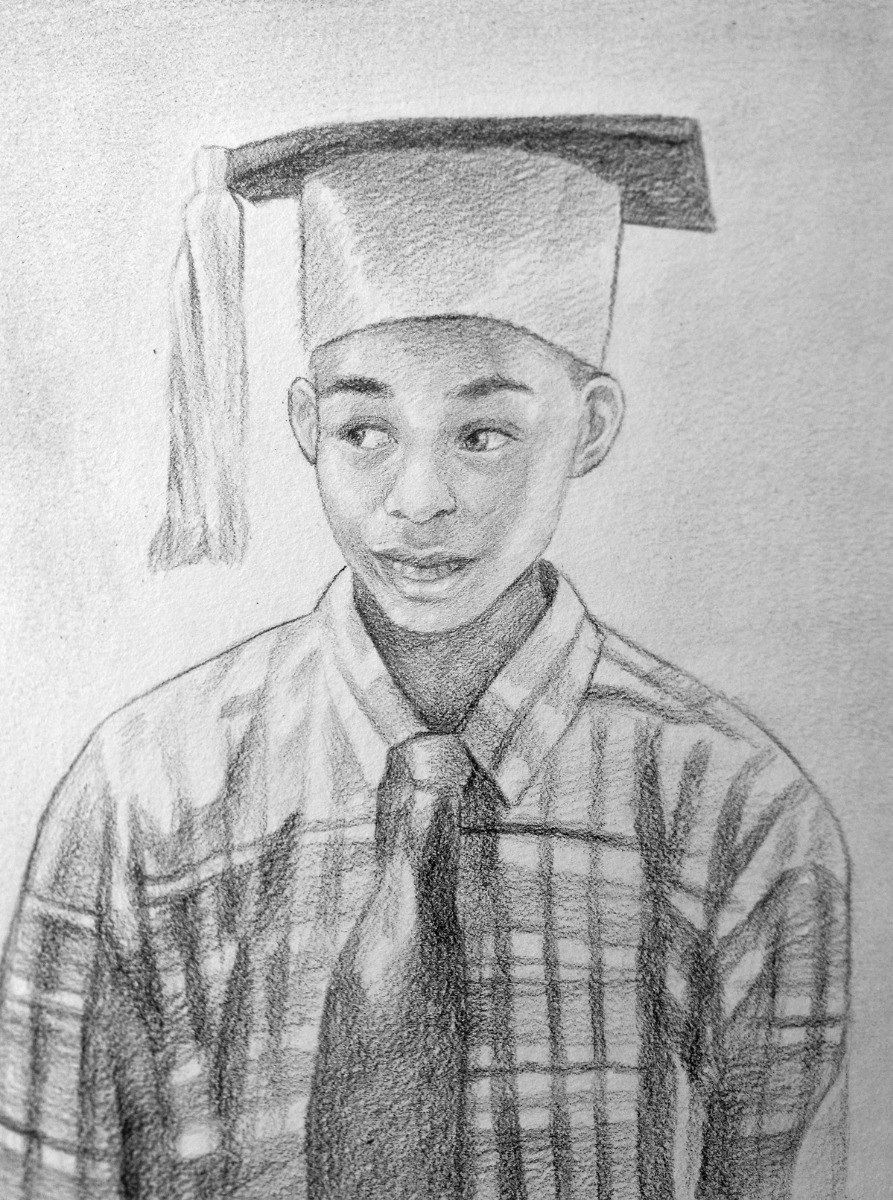 A commissioned pencil sketch of a boy wearing a graduation hat.