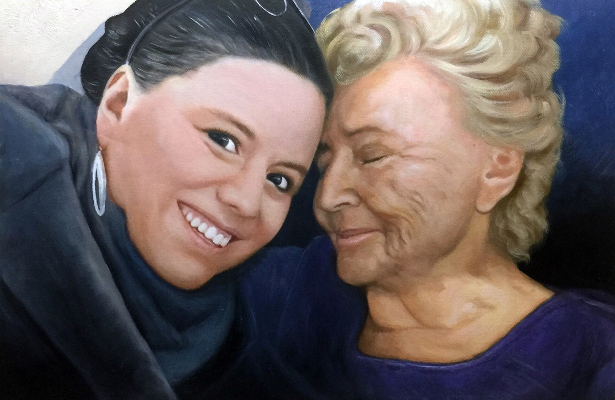 A fine brush oil painting depicting a grandmother and granddaughter hugging each other.
