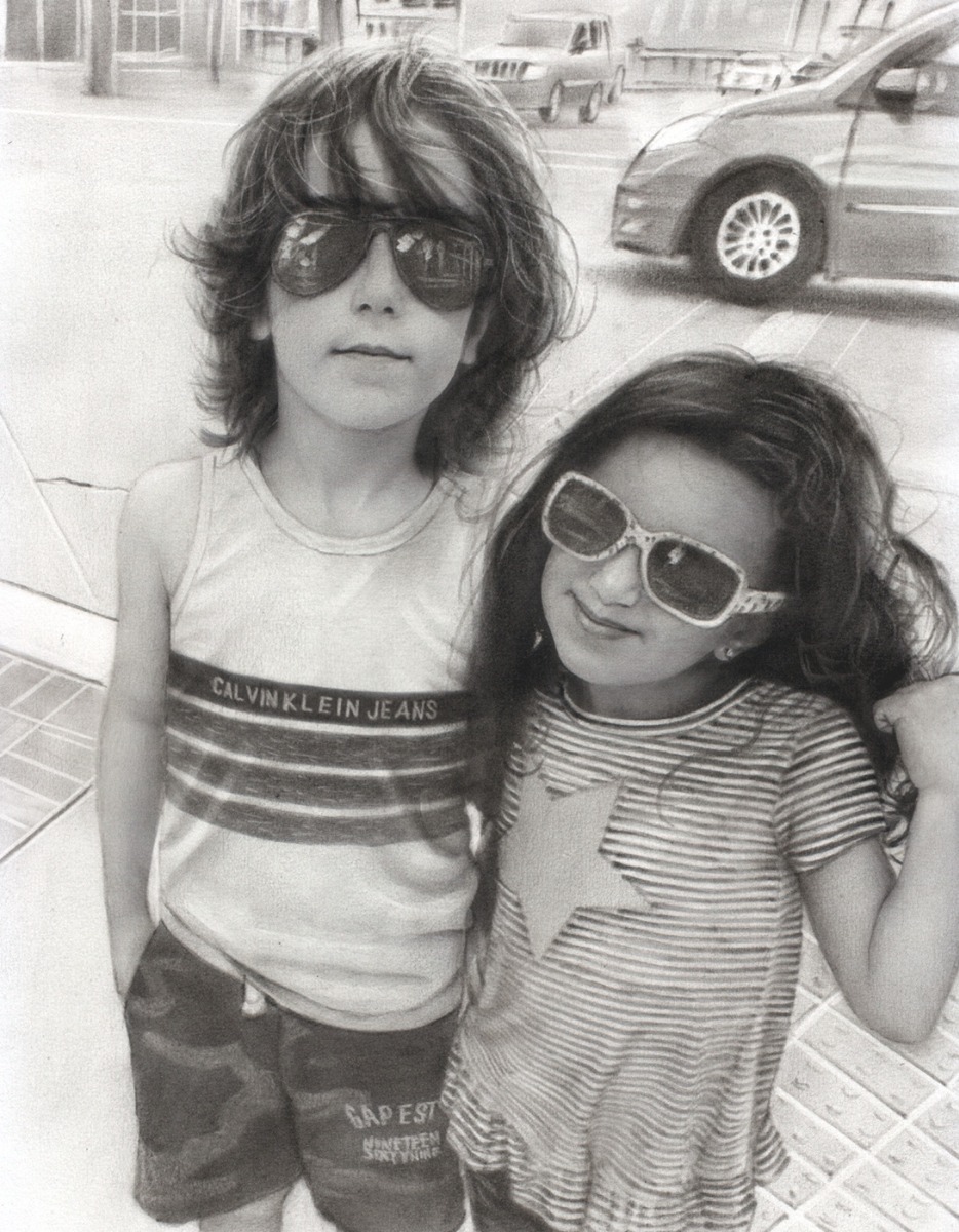 A black and white portrait of best friends wearing sunglasses.