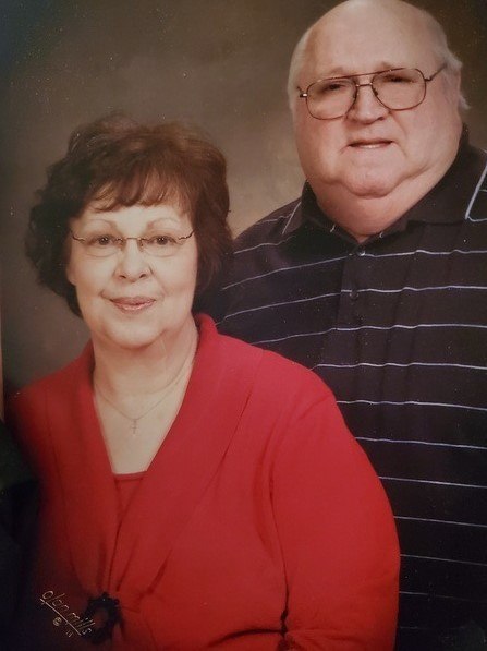 An older couple posing for a photo.