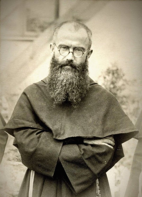 An old photo of a man with a beard and glasses.