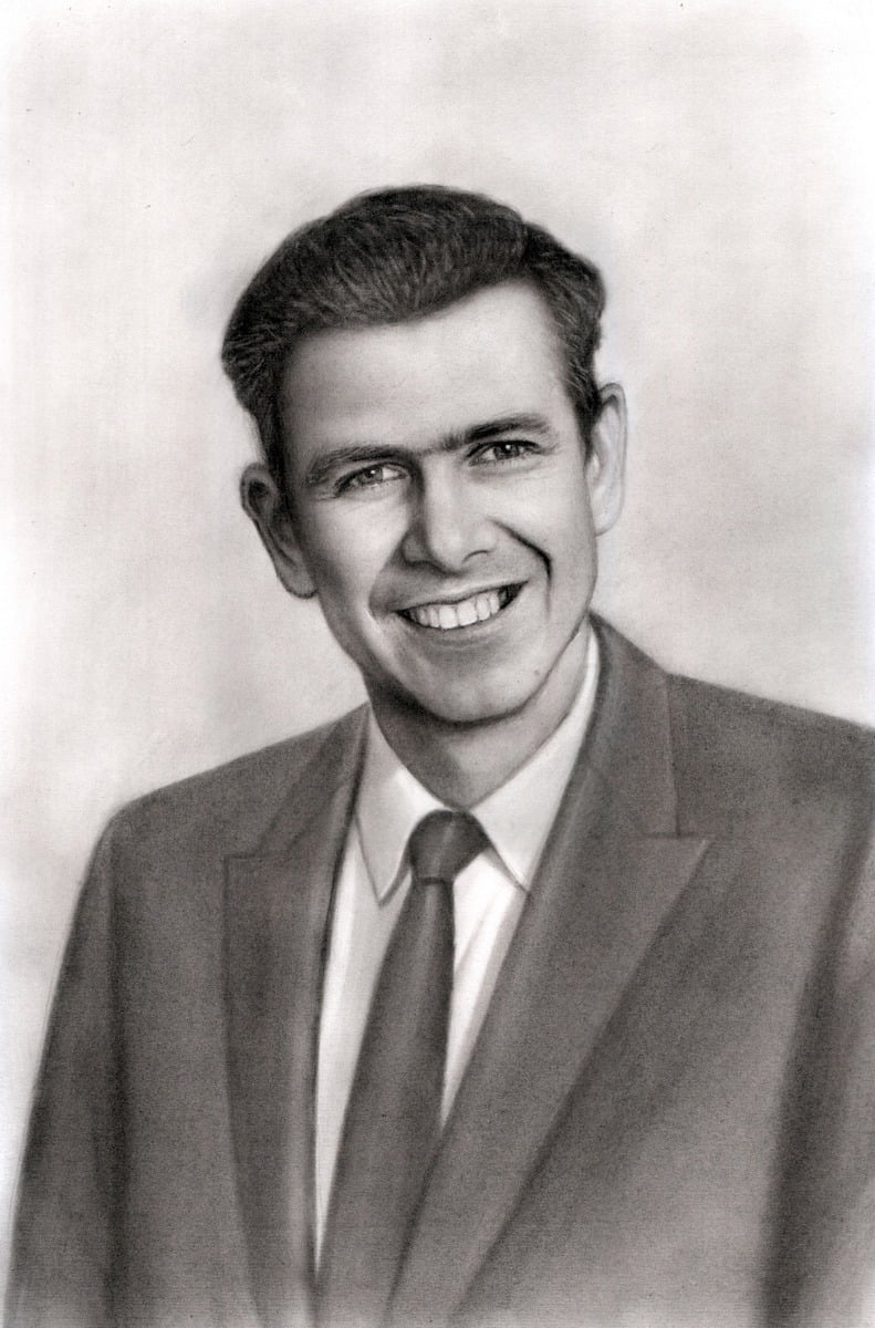 A premium charcoal drawing of a man in a suit and tie.