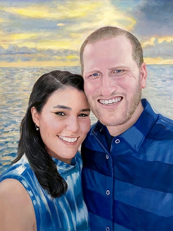 A photo of pastel colored painting of a man and woman smiling in front of the ocean.